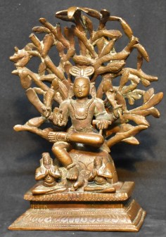 Dakshinamurthy under a tree