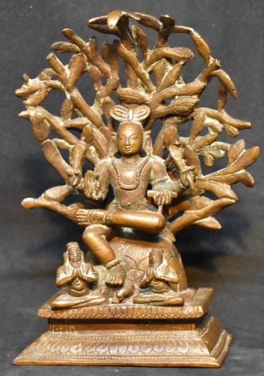 Dakshinamurthy under a tree